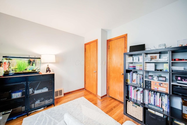 sitting room featuring light hardwood / wood-style flooring