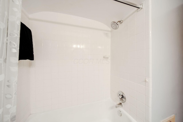 bathroom featuring shower / tub combo with curtain