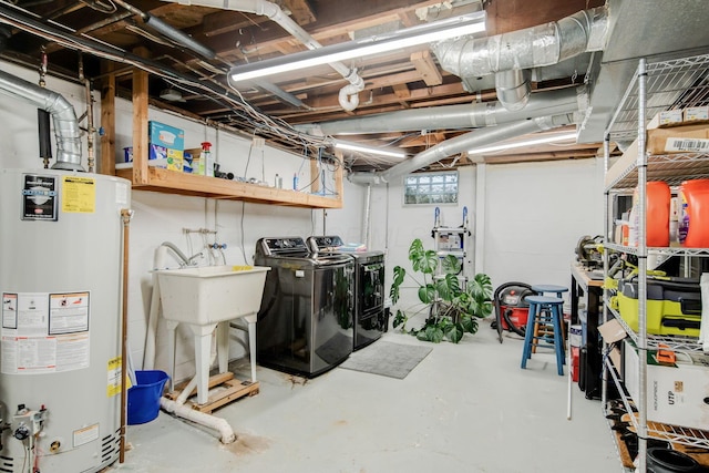 basement featuring gas water heater and independent washer and dryer