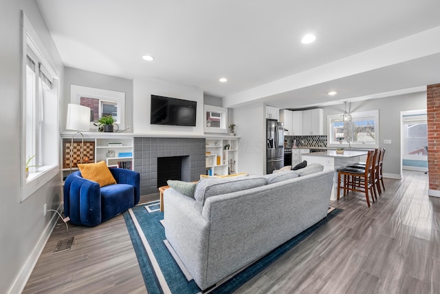 living room with light hardwood / wood-style flooring