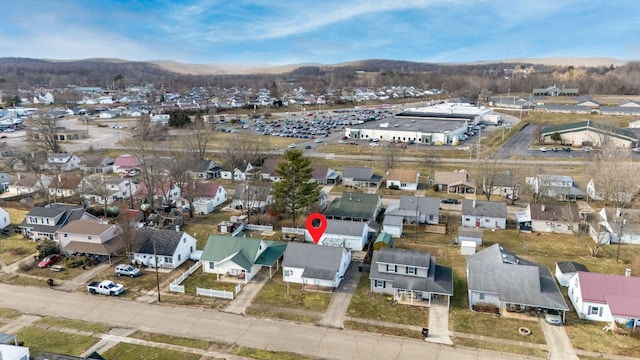 drone / aerial view with a residential view and a mountain view