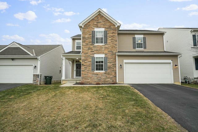 view of front facade featuring a garage and a front lawn