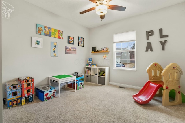 recreation room with ceiling fan and carpet floors