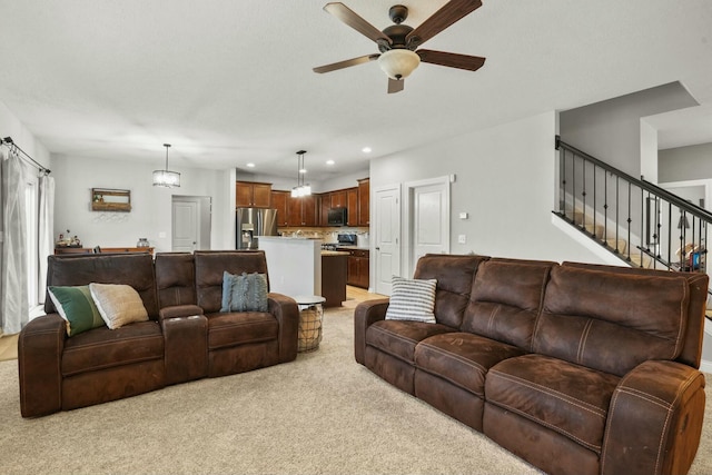 living room featuring ceiling fan and light carpet