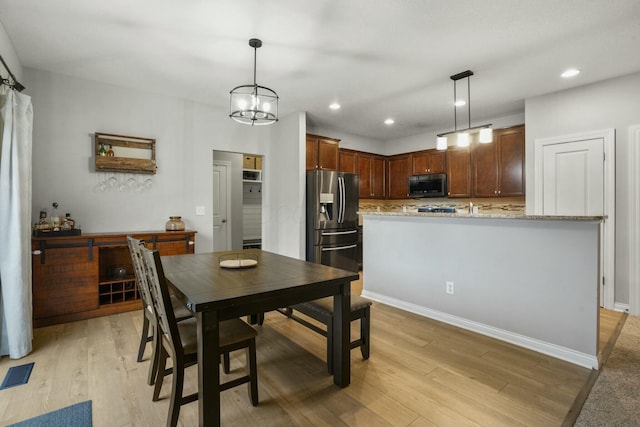 dining room featuring light wood-type flooring