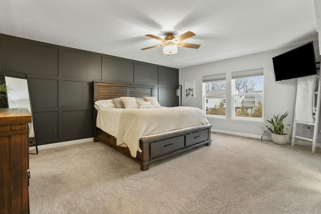 bedroom featuring light carpet and ceiling fan