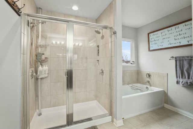 bathroom with separate shower and tub