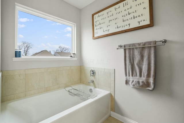 bathroom with a tub to relax in