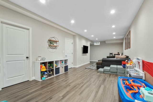 game room with wood-type flooring