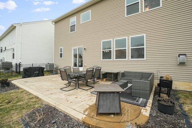 back of house with cooling unit and outdoor lounge area