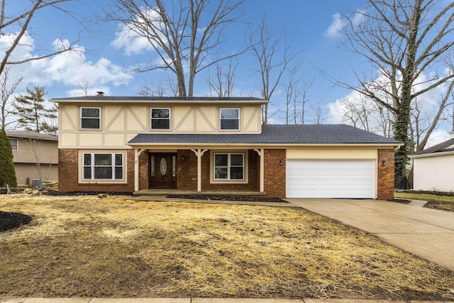 tudor house featuring brick siding, stucco siding, covered porch, an attached garage, and driveway