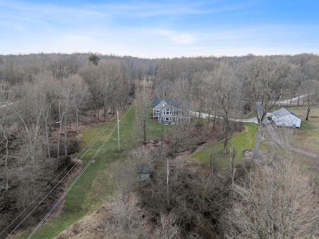 drone / aerial view with a forest view and a rural view