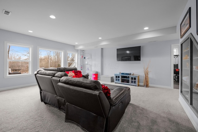 living area with carpet, visible vents, baseboards, and recessed lighting