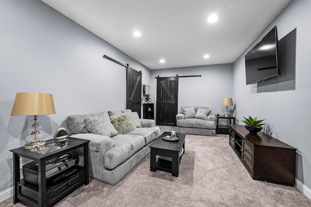 carpeted living room with a barn door, baseboards, and recessed lighting