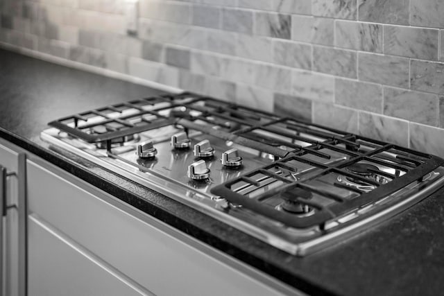 interior details featuring dark countertops and stainless steel gas cooktop