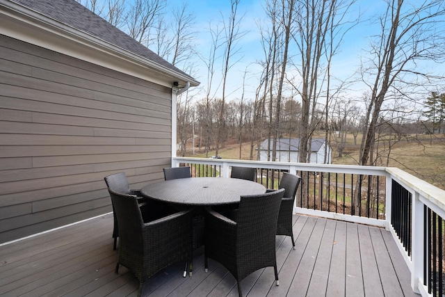 deck with outdoor dining area