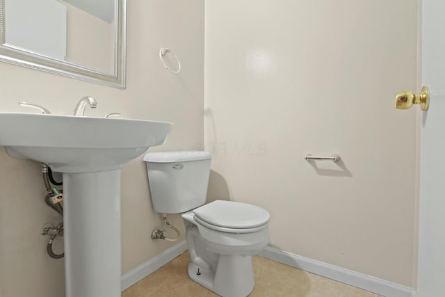 bathroom featuring tile patterned floors and toilet