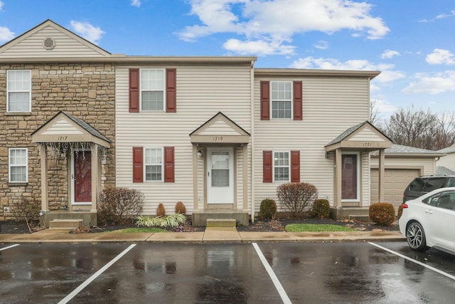 multi unit property featuring a garage