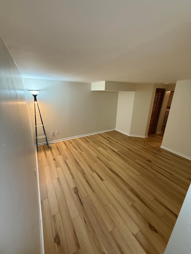 basement featuring light wood-type flooring