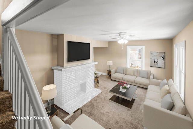 living room with ceiling fan, carpet floors, and a fireplace