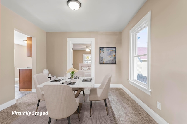 view of carpeted dining area