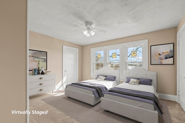 carpeted bedroom featuring ceiling fan