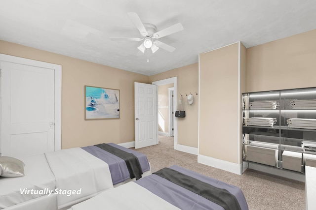 carpeted bedroom featuring ceiling fan