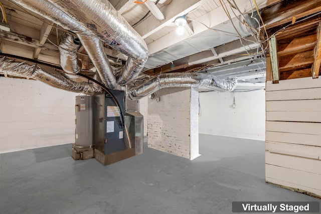 basement featuring electric water heater and heating unit