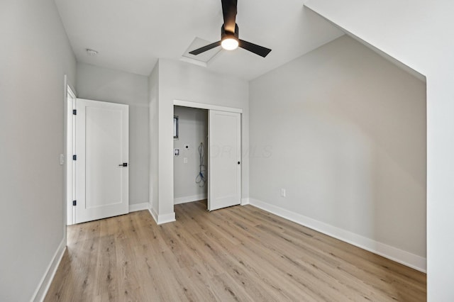 unfurnished bedroom with ceiling fan, a closet, light wood-type flooring, and baseboards