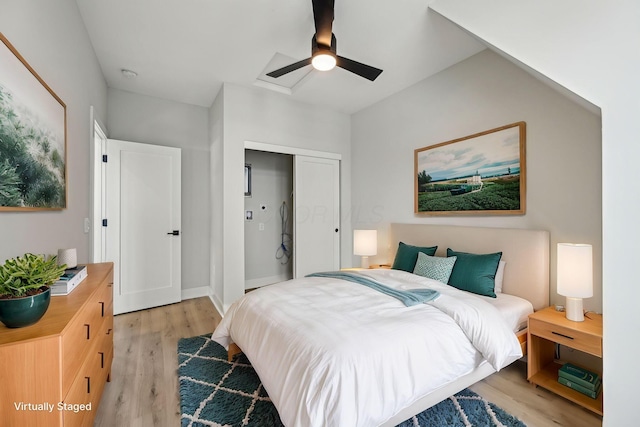 bedroom with light wood finished floors, a ceiling fan, and a closet