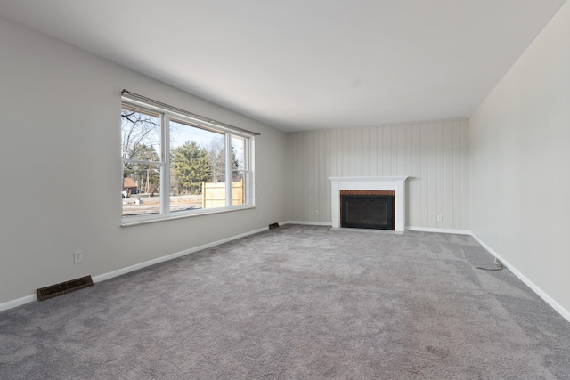 unfurnished living room with carpet