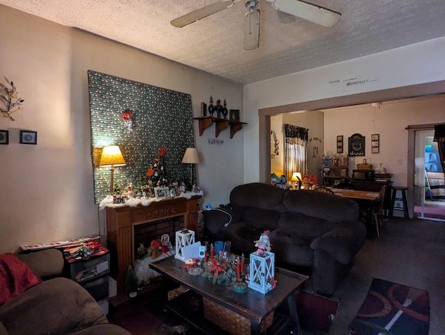 living room featuring a textured ceiling and ceiling fan