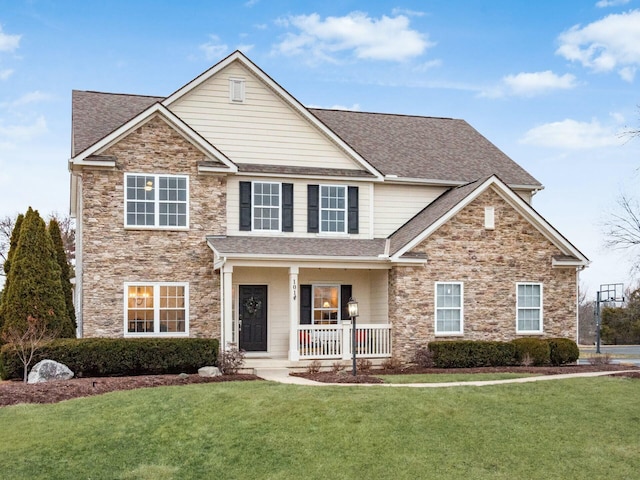 view of front of property with a porch and a front lawn