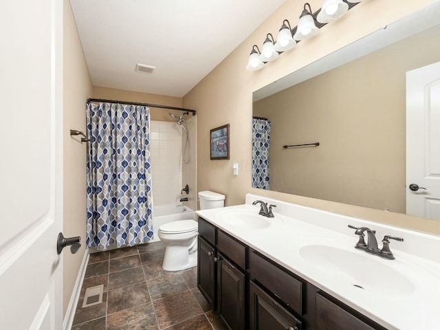 full bathroom featuring shower / tub combo with curtain, vanity, and toilet