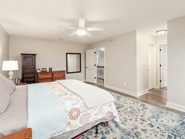 bedroom featuring wood-type flooring and ceiling fan