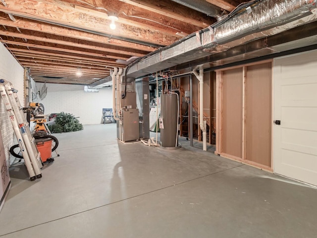 basement with heating unit and gas water heater