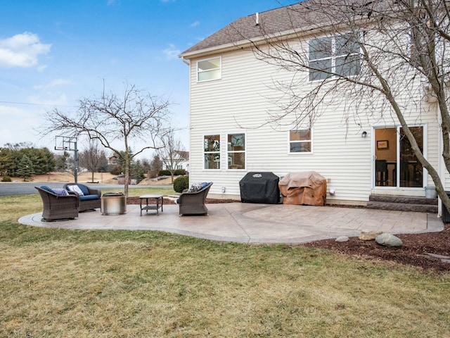 rear view of house with a lawn and a patio