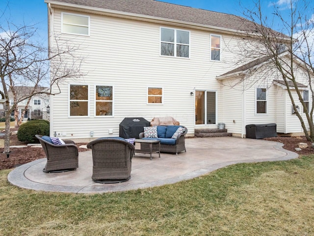 rear view of property with an outdoor living space, a patio, and a lawn