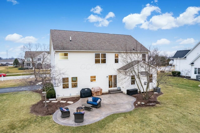 rear view of house with cooling unit, a yard, and a patio