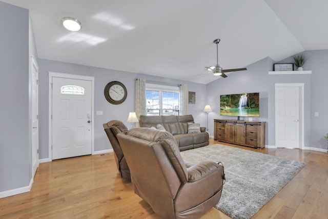 living room featuring ceiling fan, lofted ceiling, and light hardwood / wood-style floors