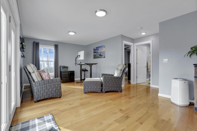 sitting room featuring light hardwood / wood-style floors