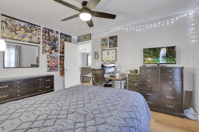 bedroom with ceiling fan and light hardwood / wood-style floors