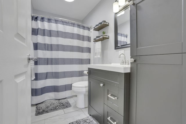 bathroom featuring vanity, toilet, and a shower with shower curtain