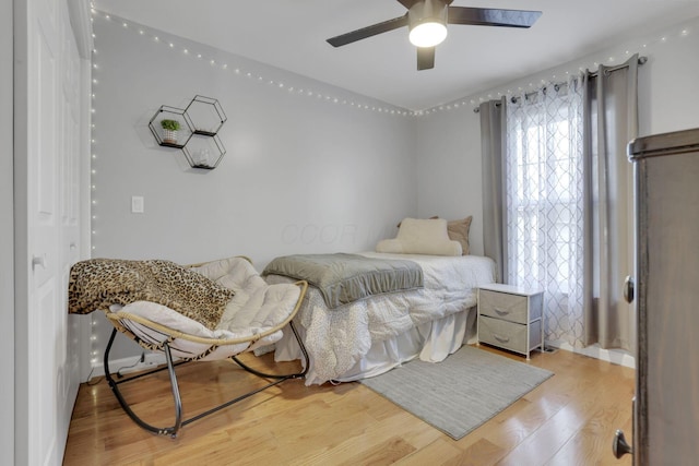 bedroom with hardwood / wood-style flooring and ceiling fan