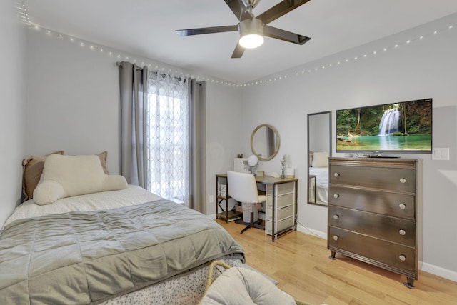 bedroom with ceiling fan and light wood-type flooring