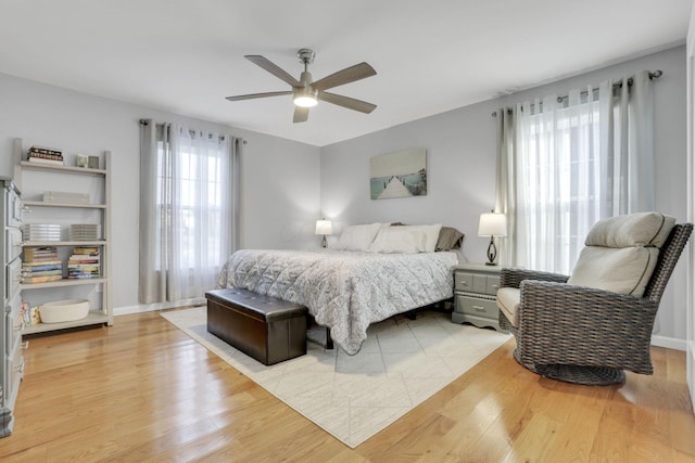 bedroom featuring light hardwood / wood-style flooring and ceiling fan