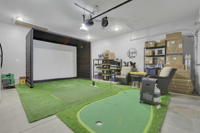 playroom with golf simulator and concrete flooring