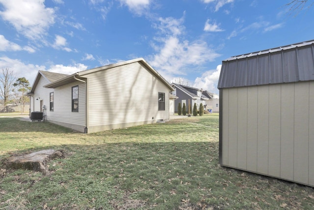 view of property exterior featuring cooling unit and a lawn