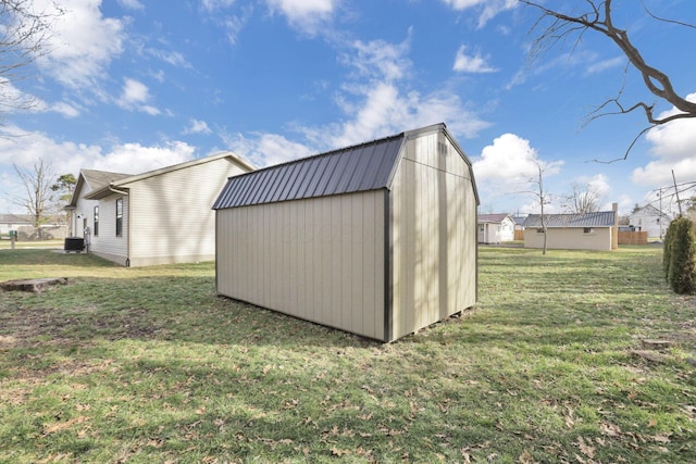 view of outbuilding with a lawn