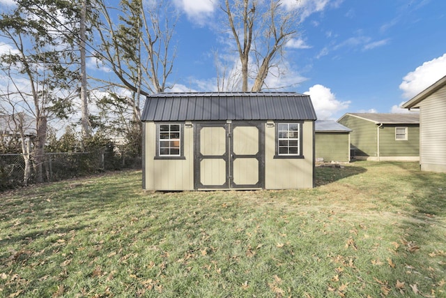 view of outdoor structure with a lawn